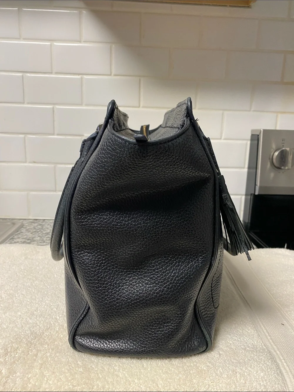 kate spade Black Pebbled Leather Satchel with Tassel and Front Zip